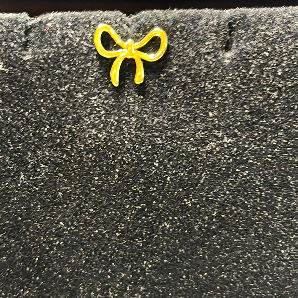 Bow stud earring
New.  
Pet / smoke free home